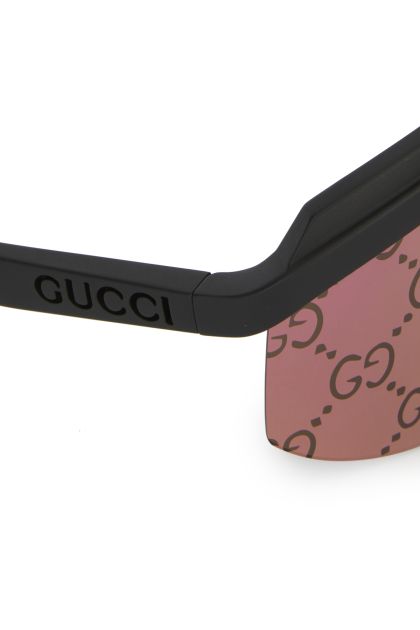 Black acetate sunglasses with pink lenses